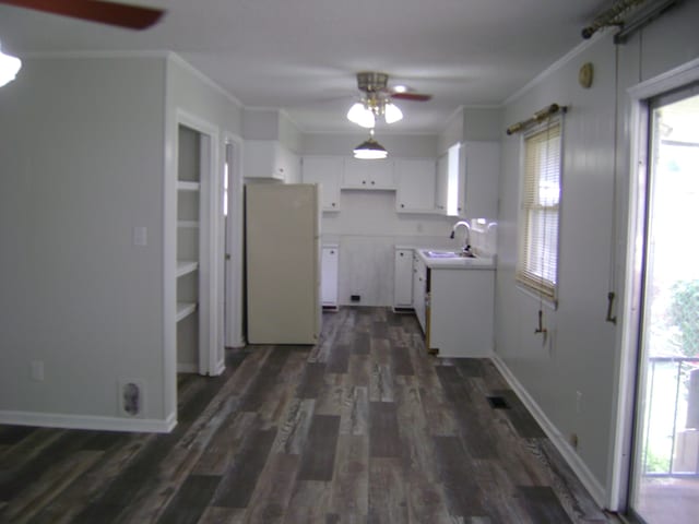 kitchen featuring ceiling fan, white cabinets, white refrigerator, and dark hardwood / wood-style floors