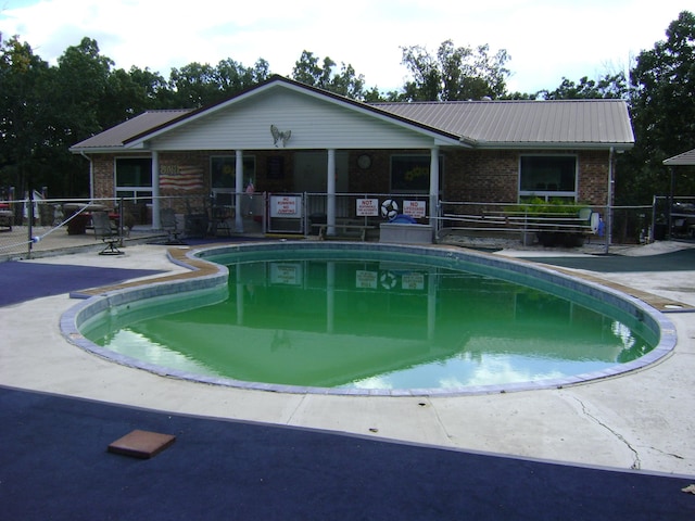 view of pool featuring a patio area