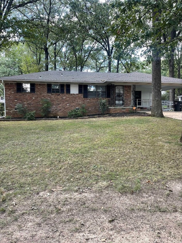 ranch-style house with a carport and a front yard