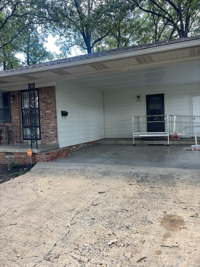 ranch-style house with a carport