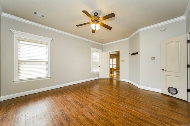 unfurnished room with ceiling fan, ornamental molding, and dark hardwood / wood-style flooring