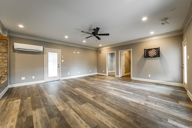 interior space with ornamental molding, hardwood / wood-style floors, ceiling fan, and a wall unit AC