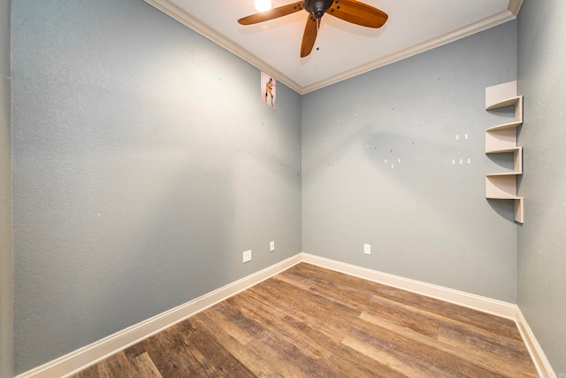 empty room with crown molding, hardwood / wood-style floors, and ceiling fan