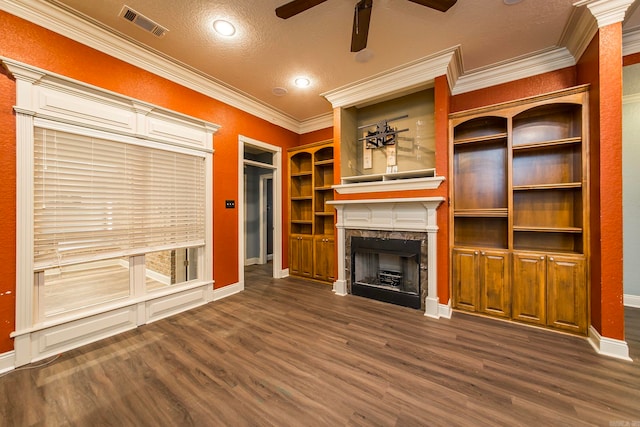 unfurnished living room with a textured ceiling, crown molding, dark hardwood / wood-style flooring, and ceiling fan