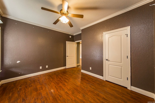 unfurnished bedroom with ceiling fan, dark hardwood / wood-style floors, and crown molding