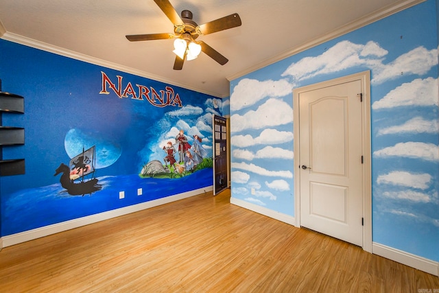 empty room with wood-type flooring, ceiling fan, and crown molding