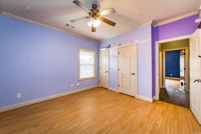 unfurnished bedroom with crown molding, ceiling fan, and light hardwood / wood-style flooring