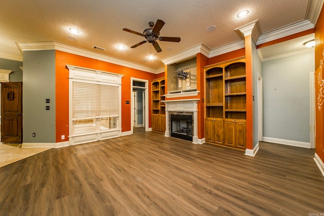 unfurnished living room with a textured ceiling, wood-type flooring, and ceiling fan