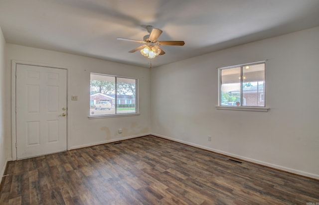 entryway featuring dark wood-type flooring and ceiling fan