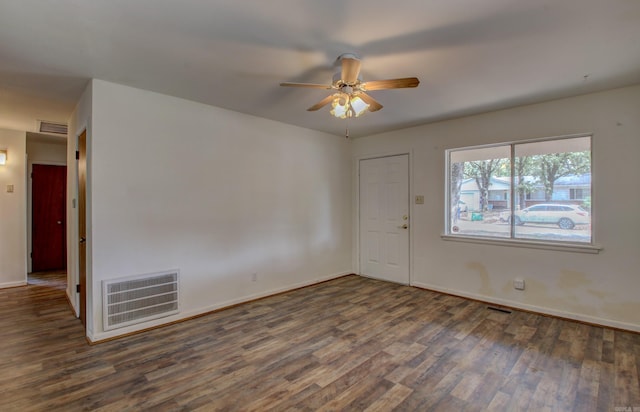 interior space with ceiling fan and dark hardwood / wood-style floors