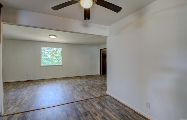 unfurnished room with dark wood-type flooring and ceiling fan