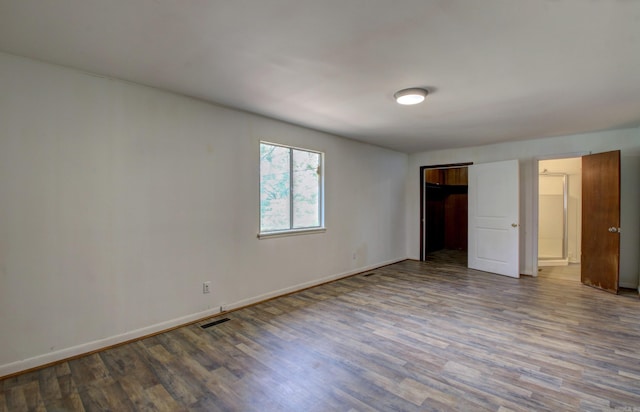 unfurnished bedroom with hardwood / wood-style floors