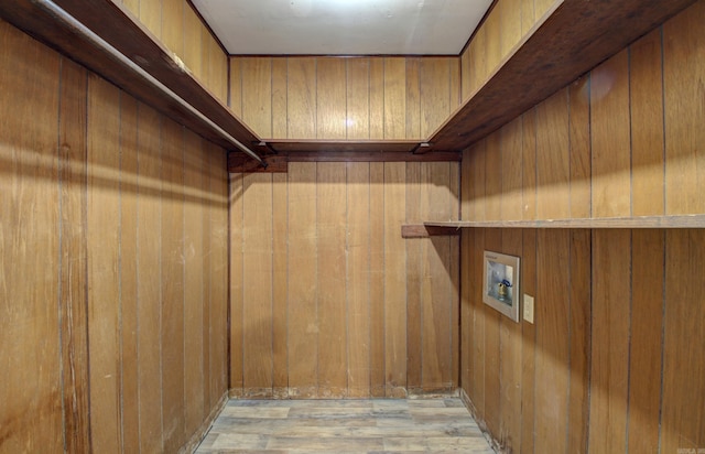 spacious closet with light hardwood / wood-style floors