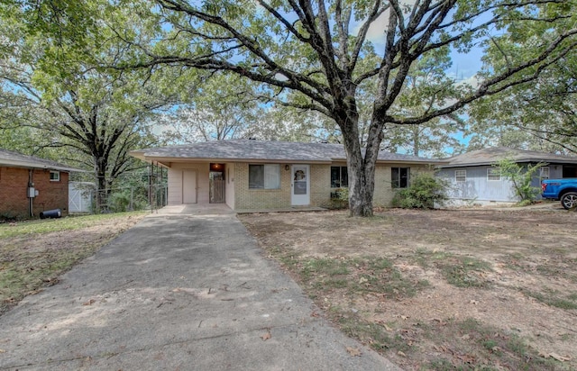 ranch-style house with a carport