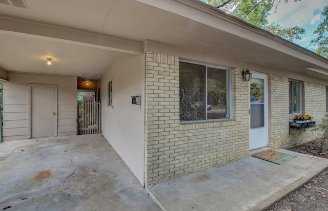 property entrance featuring a patio