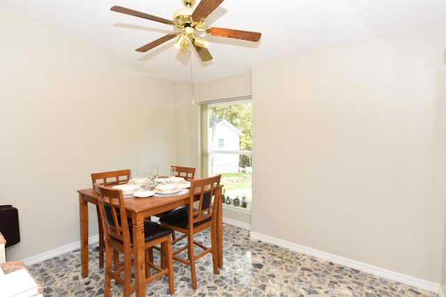 dining space featuring ceiling fan