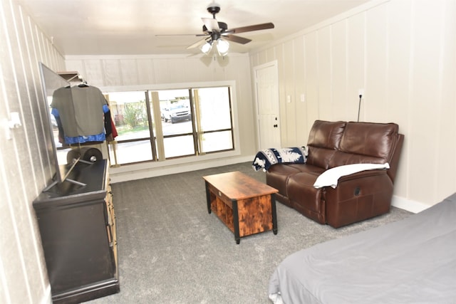 living room with carpet floors, crown molding, and ceiling fan