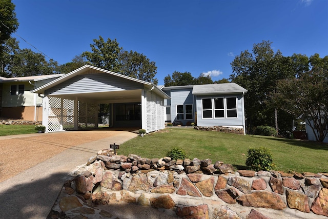 view of front facade featuring a front yard and a carport