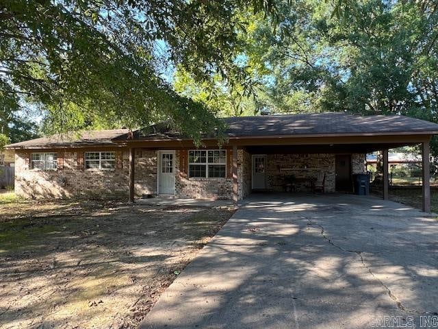 ranch-style house with a carport