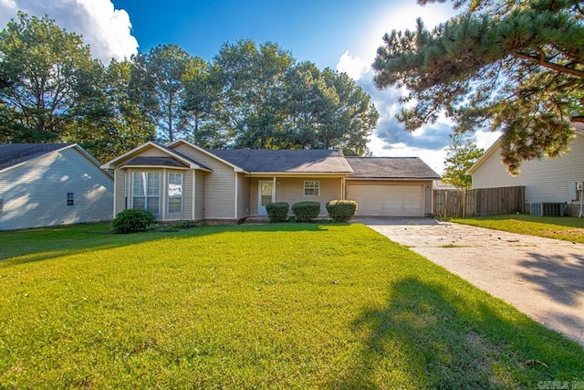 view of front of house featuring a front lawn and a garage