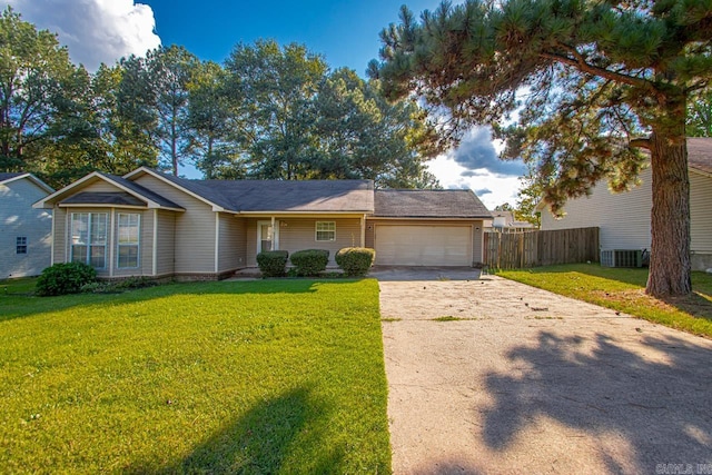 view of front of property featuring a garage, central AC, and a front yard