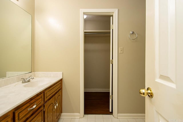 bathroom with tile patterned floors and vanity