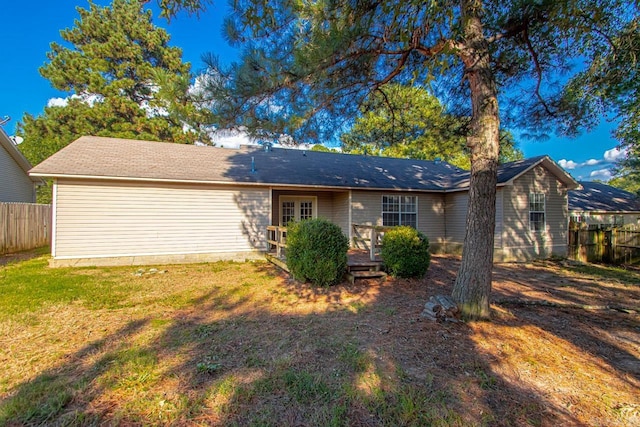 rear view of house with a lawn