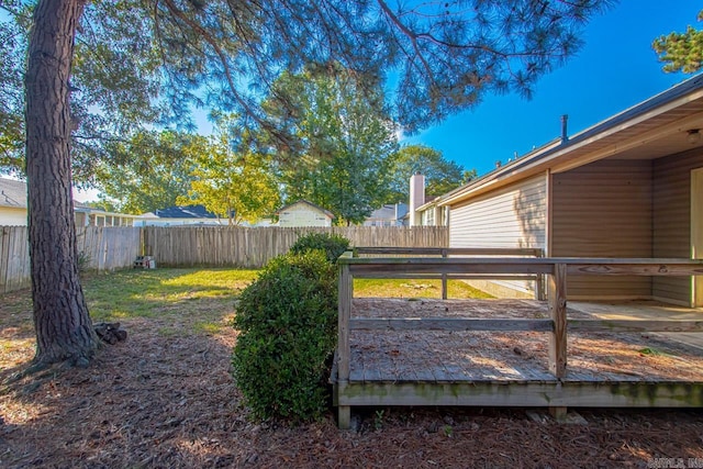 view of yard with a wooden deck