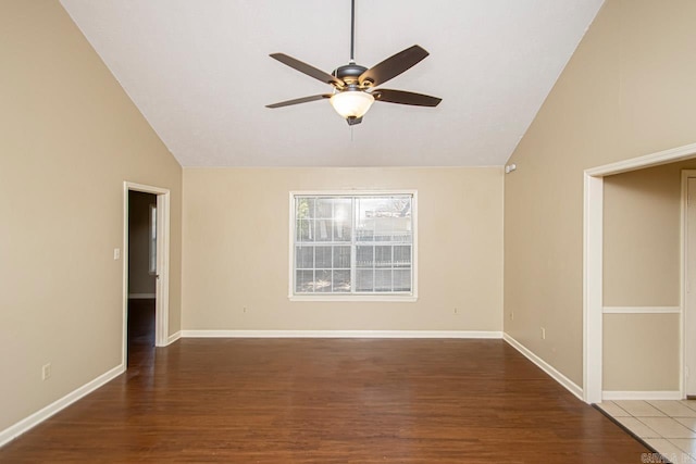 spare room featuring wood-type flooring, ceiling fan, and high vaulted ceiling