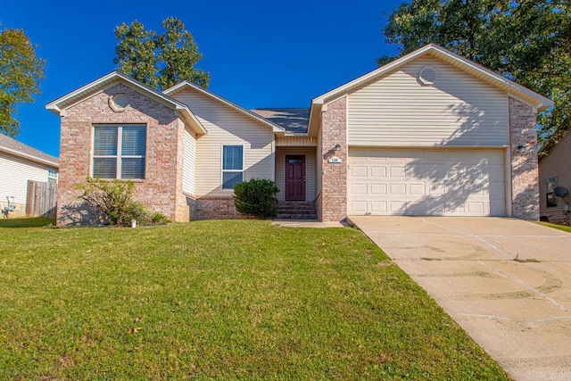 view of front of house featuring a front yard and a garage