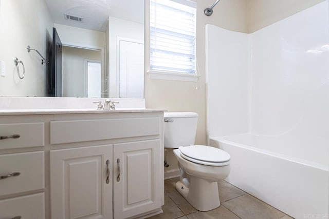 full bathroom featuring tub / shower combination, tile patterned flooring, vanity, and toilet