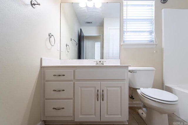 full bathroom featuring plus walk in shower, tile patterned floors, vanity, and toilet