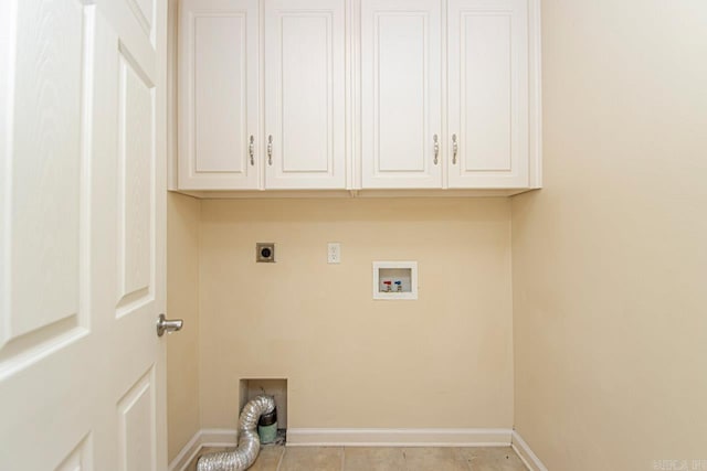 laundry room featuring cabinets, hookup for an electric dryer, washer hookup, and light tile patterned floors