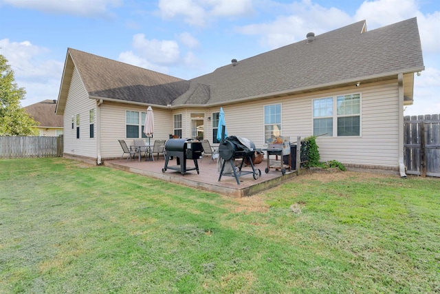 back of property with a lawn and a patio