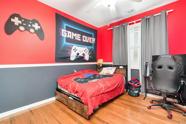 bedroom with wood-type flooring and ceiling fan