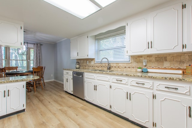 kitchen featuring light hardwood / wood-style floors, sink, white cabinets, backsplash, and stainless steel dishwasher