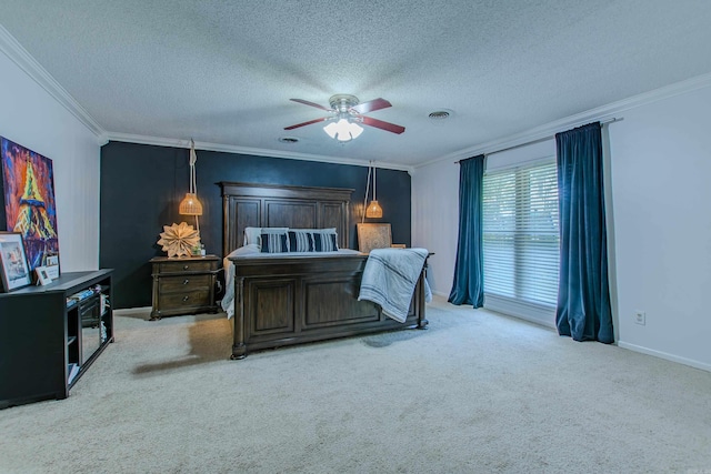 bedroom featuring ceiling fan, light colored carpet, a textured ceiling, and ornamental molding