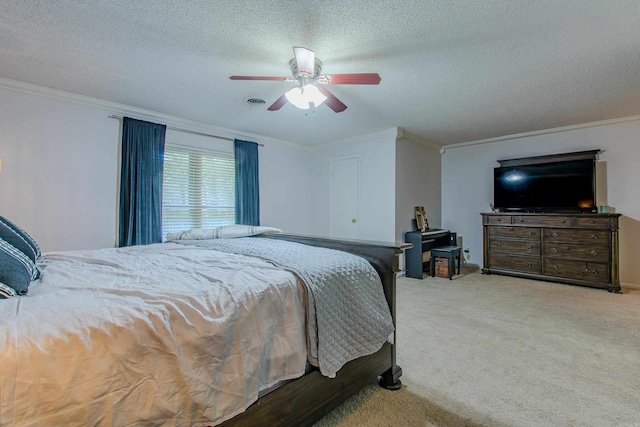 bedroom featuring ceiling fan, a textured ceiling, and light carpet