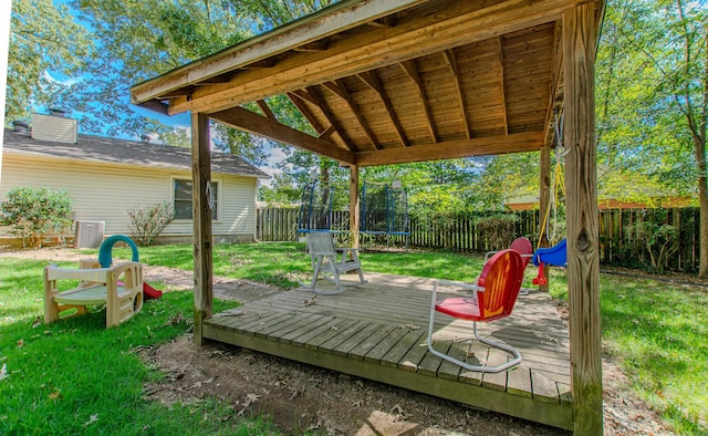 deck featuring a lawn and central AC