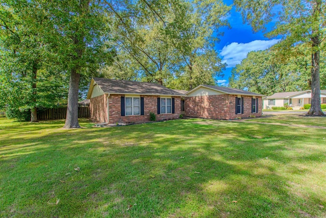 single story home featuring a front lawn