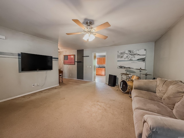 carpeted living room featuring ceiling fan