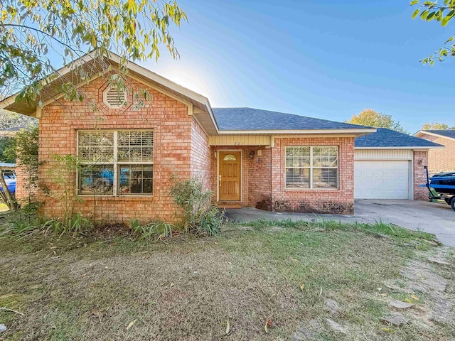 front facade with a garage and a front yard