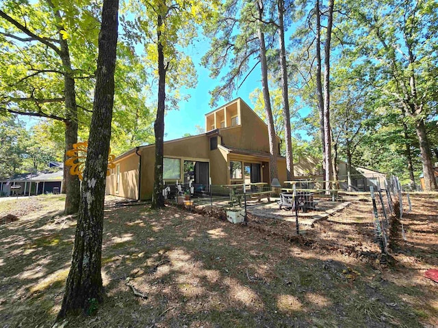 back of property featuring a patio