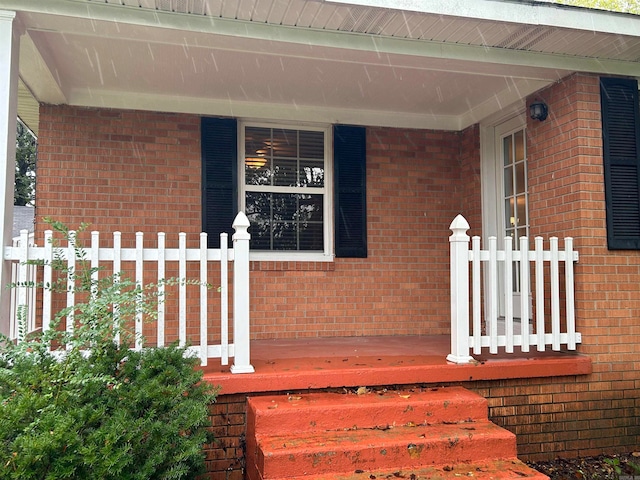 doorway to property featuring a porch