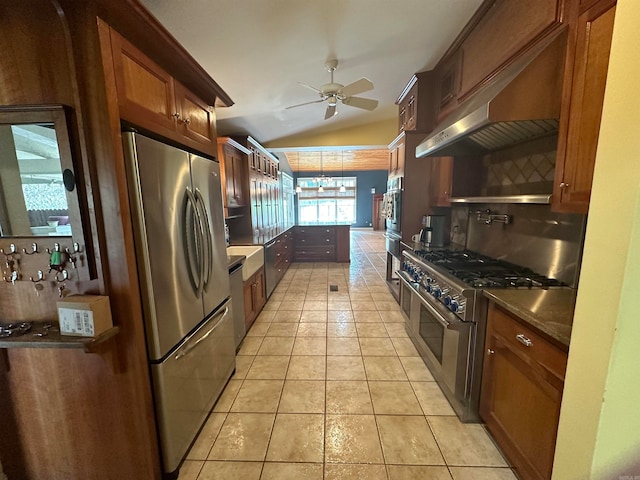 kitchen with ceiling fan, wall chimney exhaust hood, tasteful backsplash, light tile patterned floors, and appliances with stainless steel finishes