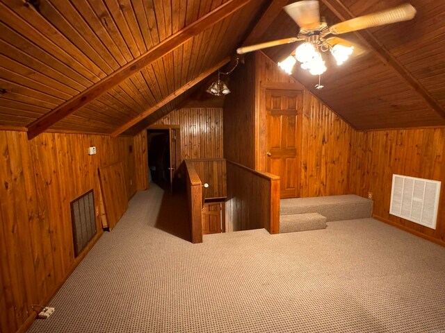 additional living space featuring wood ceiling, carpet flooring, and wooden walls