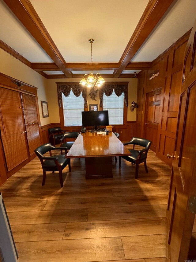 dining area featuring coffered ceiling, beam ceiling, a notable chandelier, and light wood-type flooring