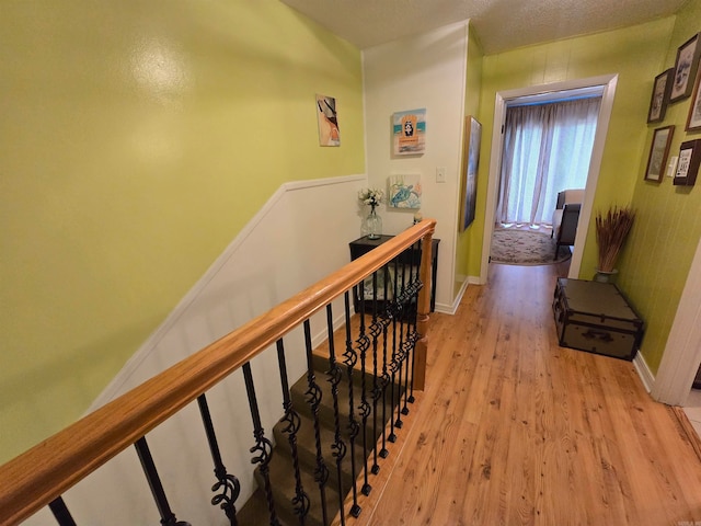 hallway with light hardwood / wood-style flooring