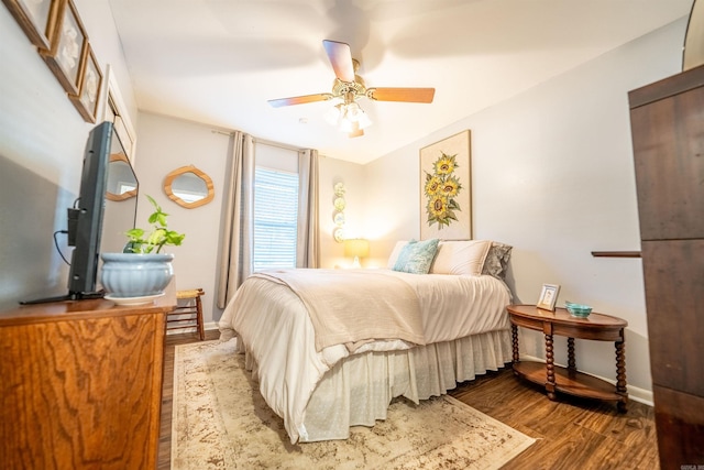 bedroom featuring wood-type flooring and ceiling fan