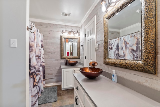 bathroom featuring a shower with curtain, vanity, and ornamental molding